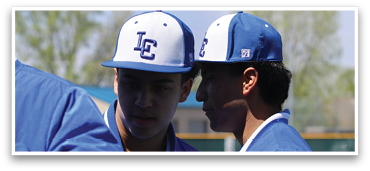 Three baseball players wearing blue and white hats and jackets are standing together on a field. AI generated content