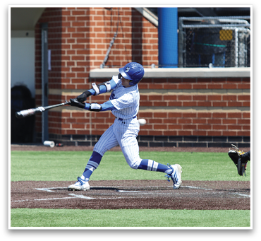 A baseball player in a white uniform is swinging a bat, attempting to hit a ball. AI generated content
