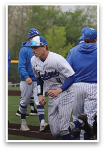 Baseball players in blue and white uniforms are hugging each other on the field. AI generated content