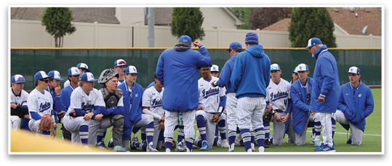 A group of baseball players wearing blue and white uniforms are gathered on a field. AI generated content