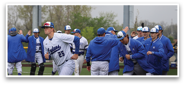 A group of baseball players wearing blue and white uniforms are hugging each other on a field. AI generated content