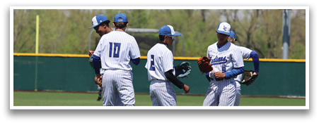 Three baseball players wearing blue and white uniforms are standing on a field. They are talking to each other and holding baseball gloves. AI generated content