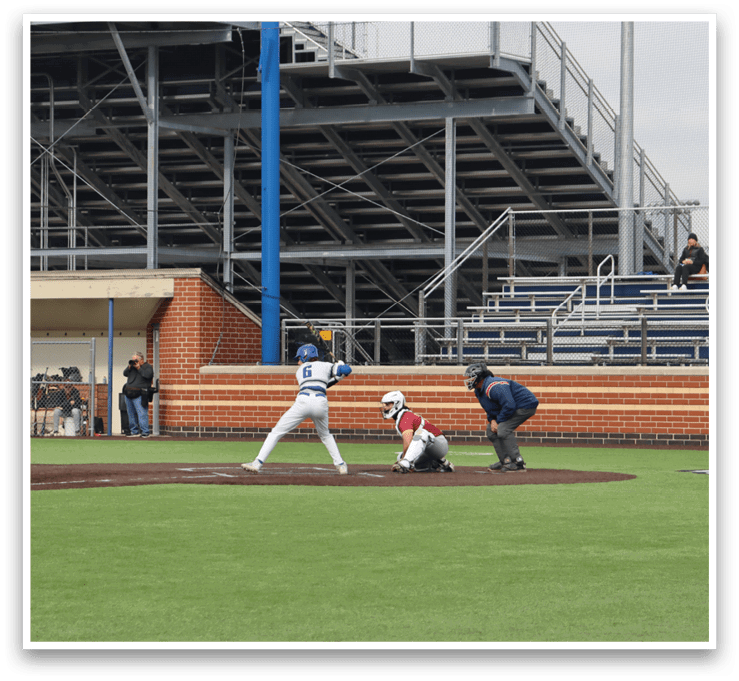 A baseball game is taking place in a stadium. Description generated by AI