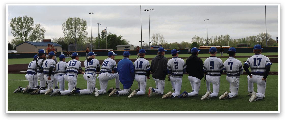 Baseball players wearing blue and white uniforms. Description generated by AI