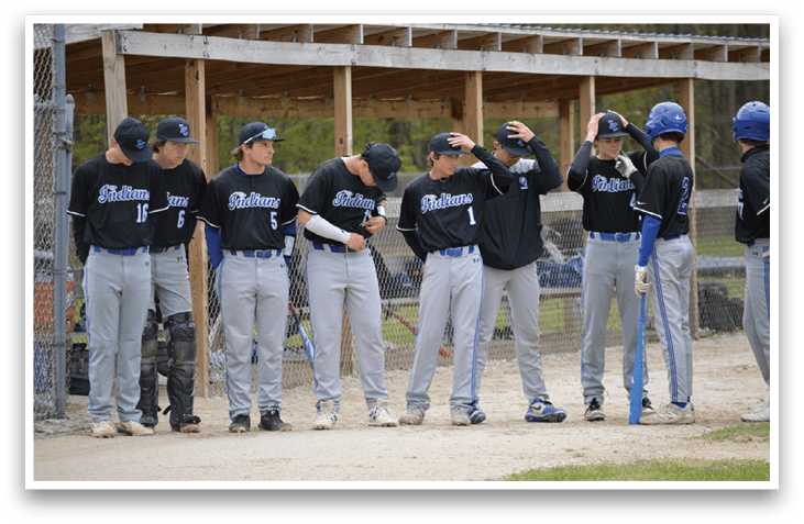 A group of baseball players standing in a line. Description generated by AI