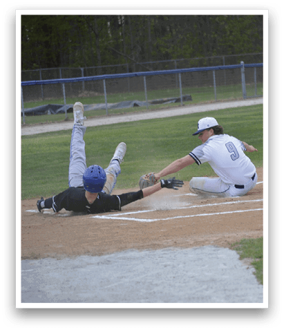 A baseball player slides into home base. Description generated by AI