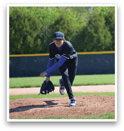 A baseball player in a blue shirt and black pants is pitching a ball. Description generated by AI