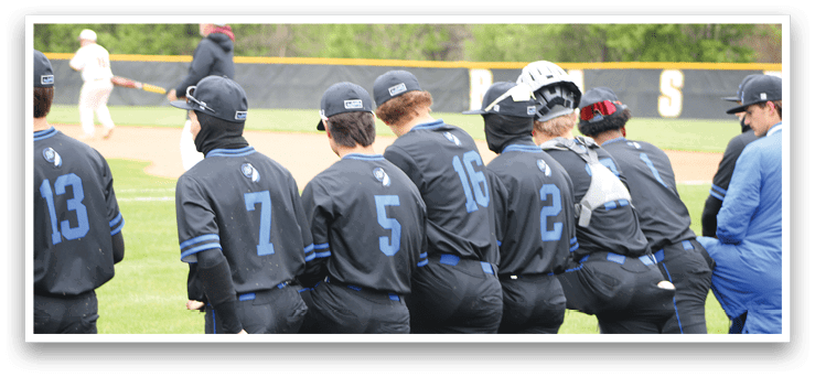 A group of baseball players wearing black jerseys with blue numbers and blue hats. Description generated by AI