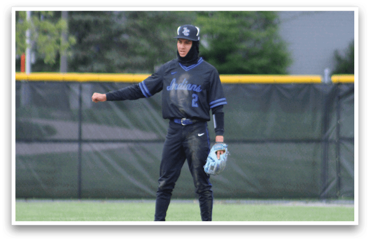 A baseball player catching a ball. Description generated by AI