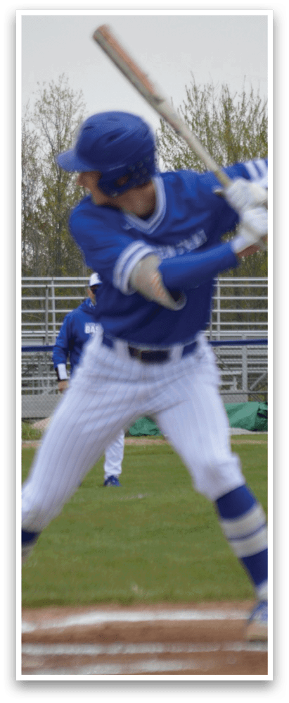 A baseball player is swinging a bat at a ball. Description generated by AI