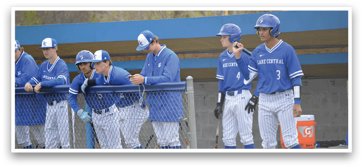 A group of baseball players wearing blue uniforms. Description generated by AI