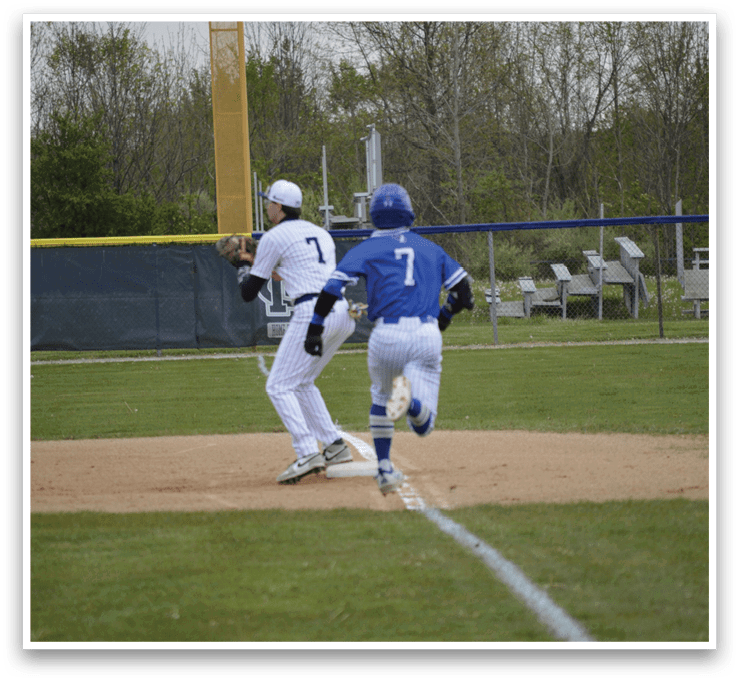 A baseball player running to a base. Description generated by AI