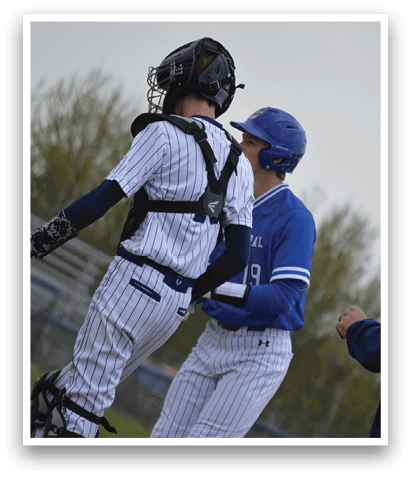 A baseball player wearing a blue and white uniform. Description generated by AI