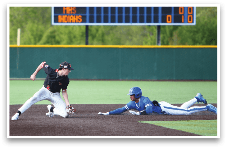 A baseball player slides into a base. Description generated by AI
