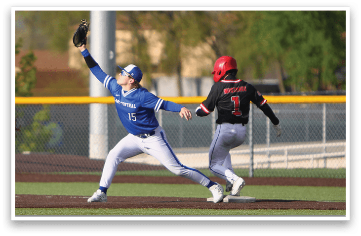 A baseball player in a blue uniform is catching a ball. Description generated by AI