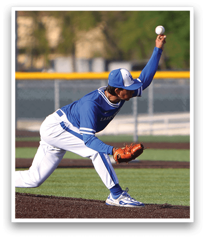 A baseball player in a blue uniform is throwing a ball. Description generated by AI