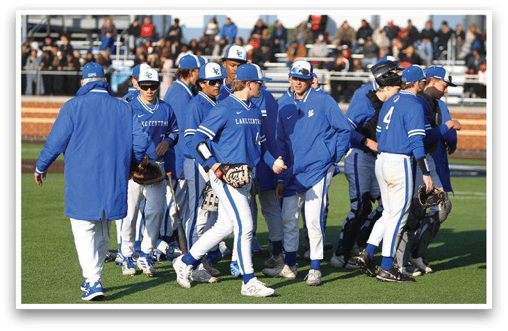 A group of baseball players wearing blue uniforms. Description generated by AI