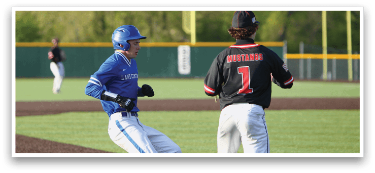 A baseball player in a blue helmet and white pants running to a base. Description generated by AI