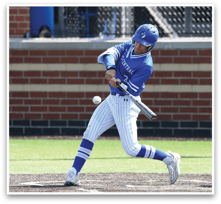 A baseball player in a blue and white uniform is swinging a bat at a ball. Description generated by AI