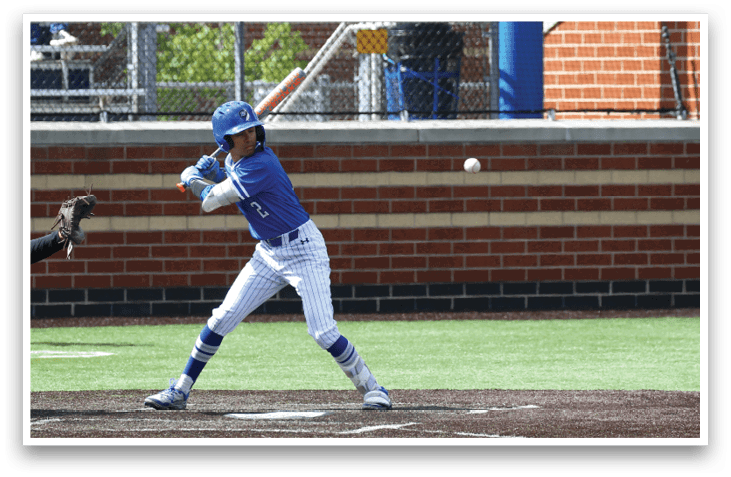 A baseball player is swinging a bat at a ball. Description generated by AI