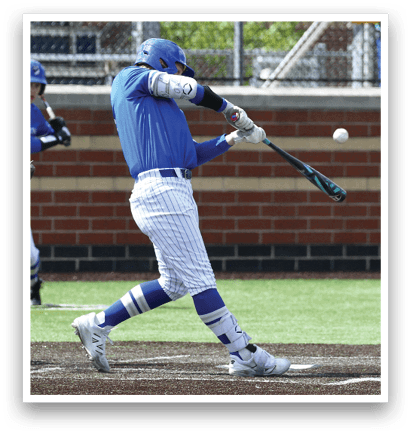 A baseball player in a blue shirt and white pants is swinging a bat at a ball. Description generated by AI