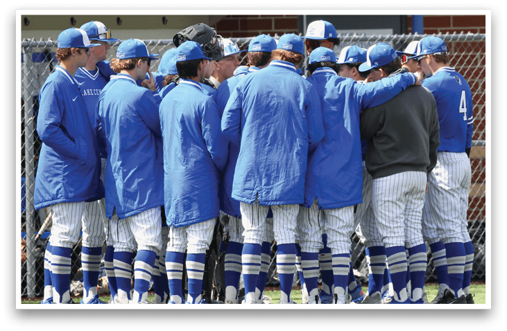 A group of people wearing blue jackets and blue and white pants. Description generated by AI