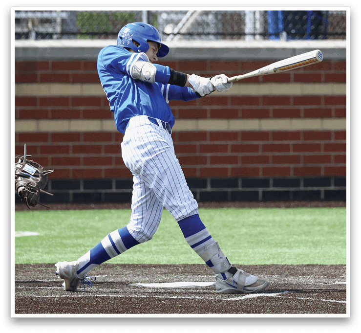 A baseball player in a blue and white uniform is swinging a bat. Description generated by AI