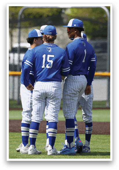 Three baseball players wearing blue and white uniforms. Description generated by AI