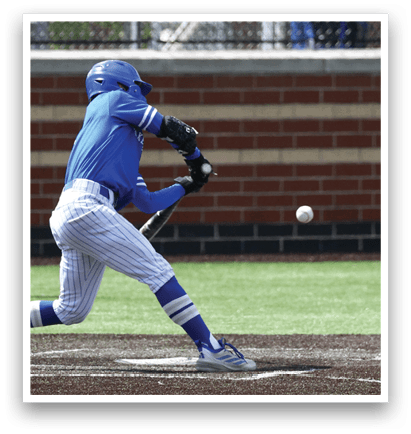 A baseball player in a blue uniform is swinging a bat at a ball. Description generated by AI