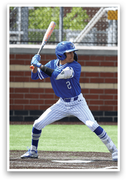 A baseball player in a blue and white uniform is swinging a bat. Description generated by AI