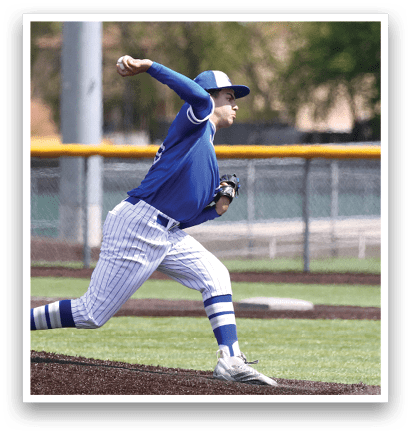 A baseball player wearing a blue shirt and white pants is throwing a ball. Description generated by AI
