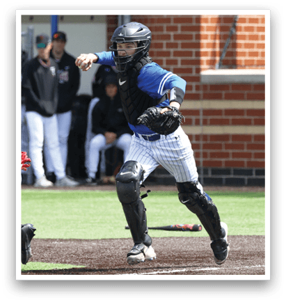 A baseball player in a blue shirt and black helmet is running to a base. Description generated by AI