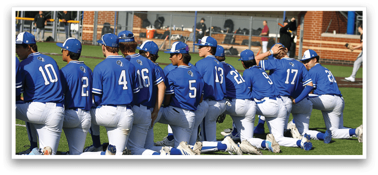 Baseball players wearing blue uniforms. Description generated by AI