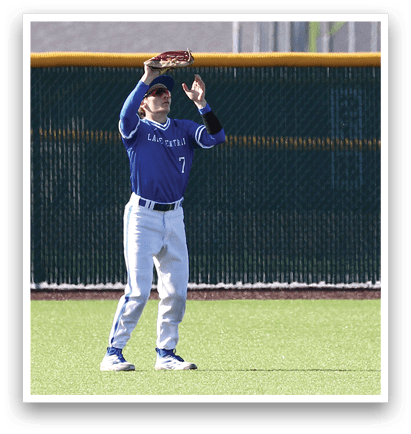 A baseball player wearing a blue and white uniform is catching a ball. Description generated by AI