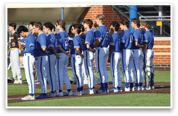 A group of baseball players wearing blue uniforms and white shoes. Description generated by AI