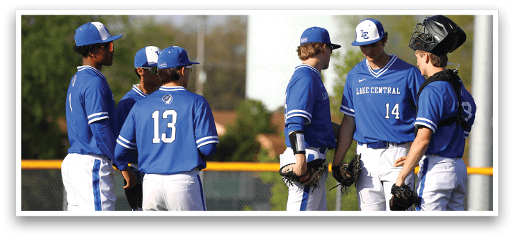 A group of baseball players wearing blue uniforms. Description generated by AI