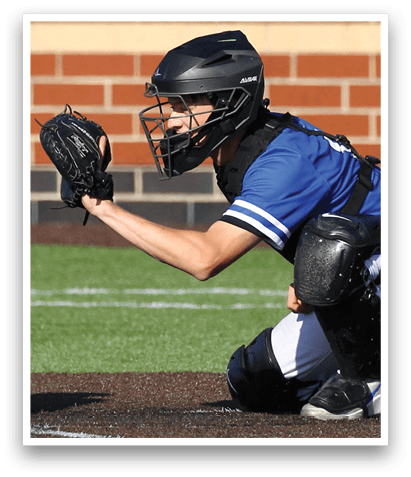 A baseball player wearing a blue shirt and black helmet. Description generated by AI