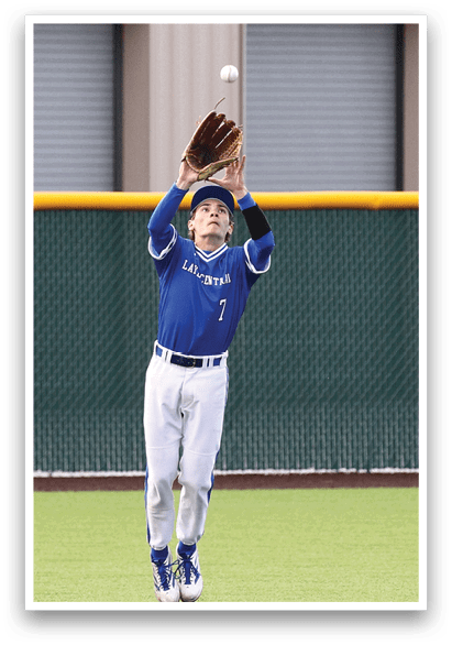 A baseball player wearing a blue shirt and white pants catching a ball. Description generated by AI