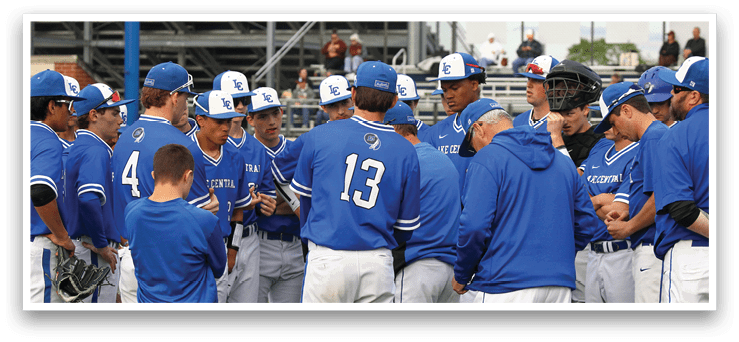 A group of baseball players wearing blue uniforms. Description generated by AI