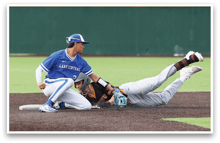 A baseball player slides into a base. Description generated by AI