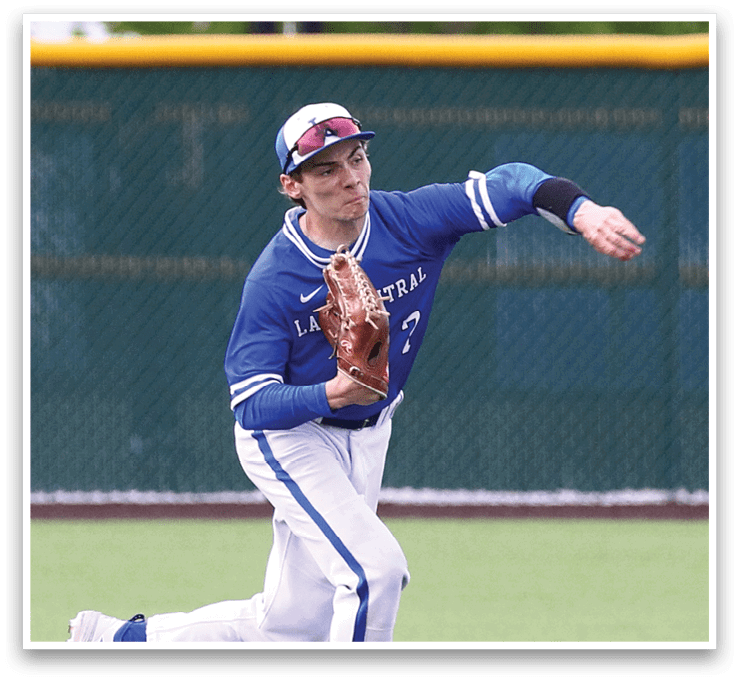 A baseball player in a blue and white uniform is throwing a ball. Description generated by AI
