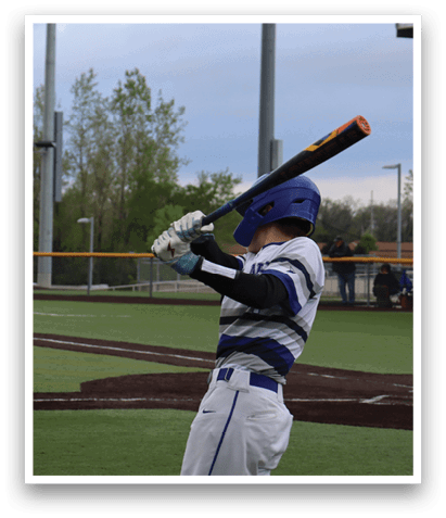 A baseball player is swinging a bat at a ball. Description generated by AI