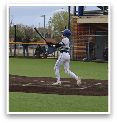 A baseball player is swinging a bat at a ball. Description generated by AI