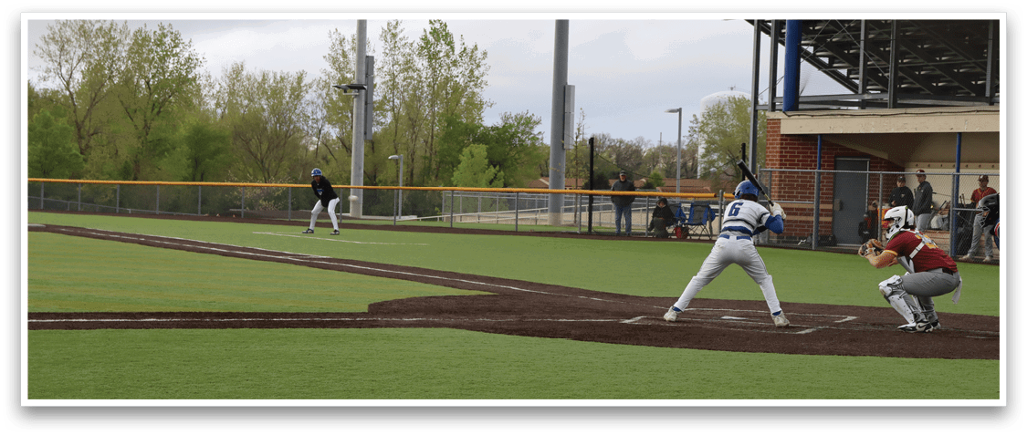 A baseball game is being played on a field. Description generated by AI