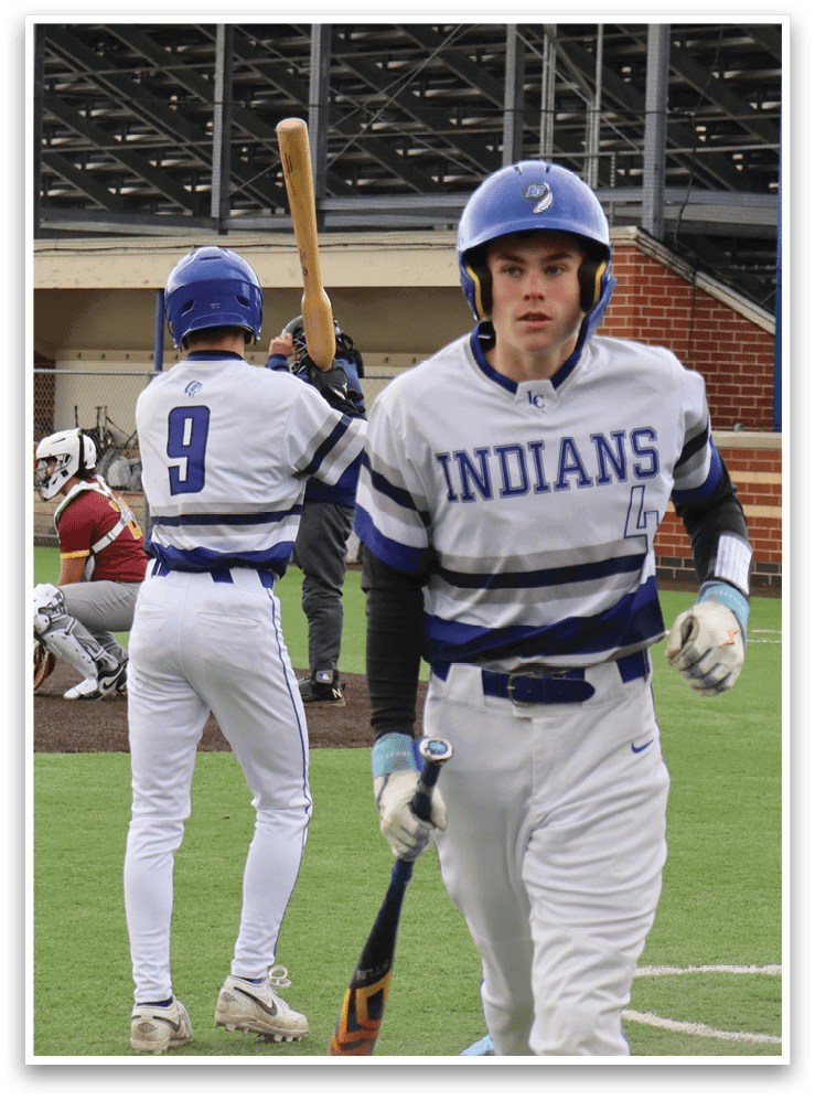 A baseball player with a bat standing on a field. Description generated by AI