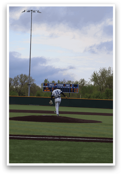 A baseball game is being played on a field. Description generated by AI