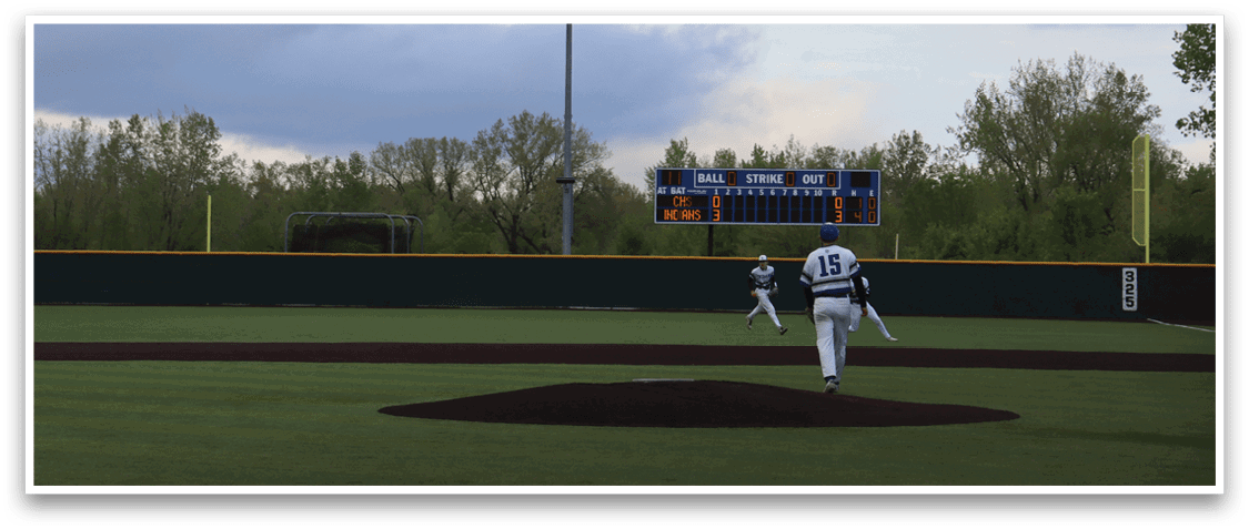 A baseball game is being played on a field. Description generated by AI