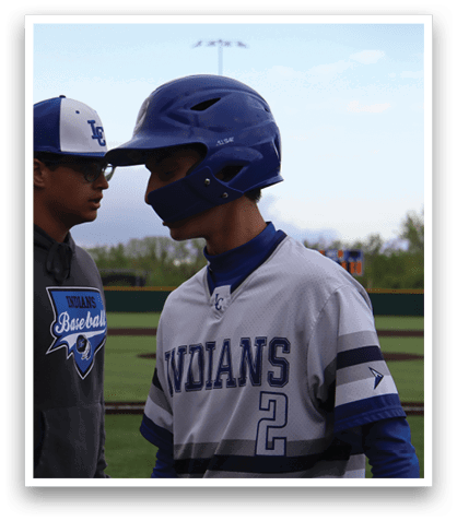 A baseball player wearing a blue and white jersey with the number 2 on it. Description generated by AI
