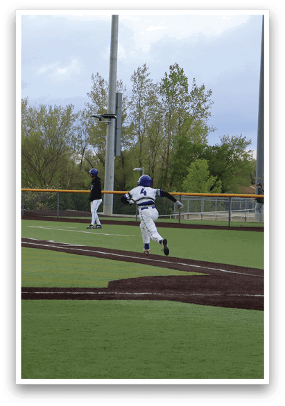 A baseball game is taking place with players on the field. Description generated by AI