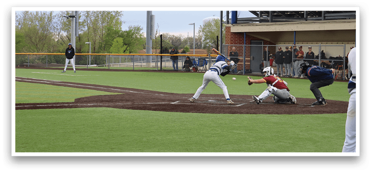A baseball game is taking place on a field with a batter, catcher, and umpire. Description generated by AI
